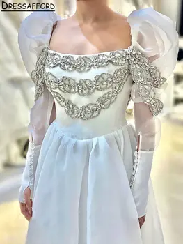 Elegantiška kvadratinė apykaklė ilgomis pūstomis rankovėmis Dubajaus vestuvinė suknelė A-Line Open Back Diamonds Beading Saudi Arabic Bridal Gown