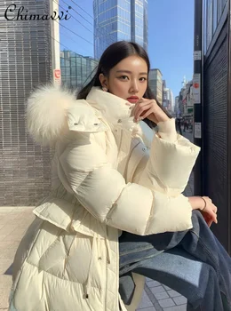 Fashion Long Down Jacket Moteriški 2023 m. žieminiai drabužiai Nauji aukščiausios klasės sustorėjimo gobtuvai Šiltas plonas temperamentas Moteriškas paltas